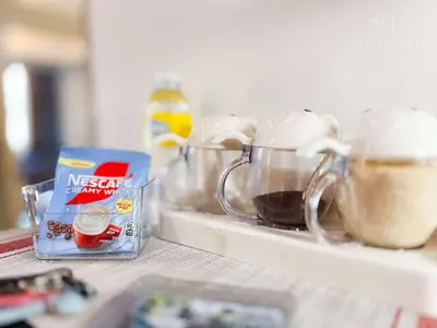a counter top with some food and a box of ingredients at R E Staycations in Manila