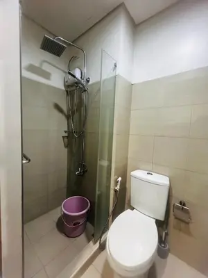 a bathroom with a toilet and a shower at Cozy Staycation at Shore Residences near Mall Of Asia MOA in Manila