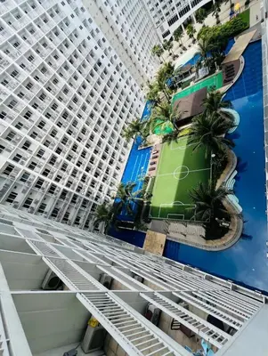 a view of the facade of a large building at Cozy Staycation at Shore Residences near Mall Of Asia MOA in Manila