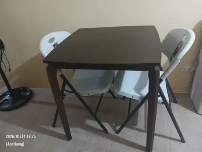 a table and two chairs sitting next to each other at GambinoAirbnb in Manila