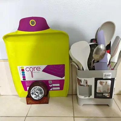 a yellow box next to a container of kitchen utensils at Fully Furnished Condo at Cyberzone-Filinvest in Manila