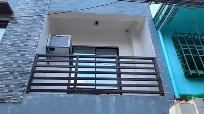 a balcony of a house with a railing on it at Makati 2C Suite Room in Manila