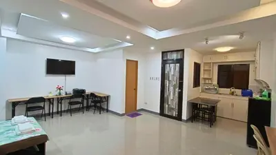 a kitchen and dining room with a table and chairs at Makati 2C Suite Room in Manila