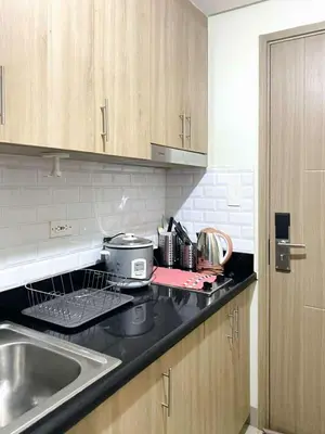 a kitchen with a sink and a counter top at Warm Retreat with Balcony at Shore 2 Residences in Manila