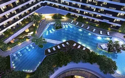 an overhead view of a large building with a swimming pool at Sunbeam - Air Residence 42nd floor in Manila