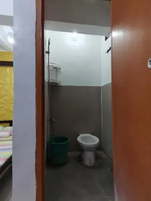 a small bathroom with a toilet in a room at Transient Room for Bypackers in Imus NO CAR PARK in Imus