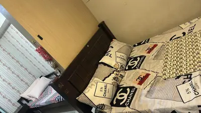 a bed with many pillows on it in a bedroom at smdc condotel in Manila
