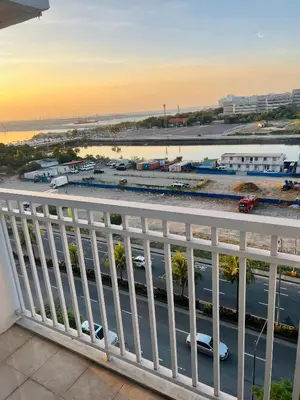 a view from a balcony of a parking lot at ESY Condotel shore 1-B in Manila