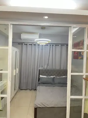 a bedroom with a bed in a room at AC Haven in Shore Residences near MOA Pasay City in Manila