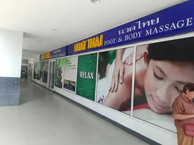 a person standing on a display shelf in a store at The Barn at Sea Residences in Manila