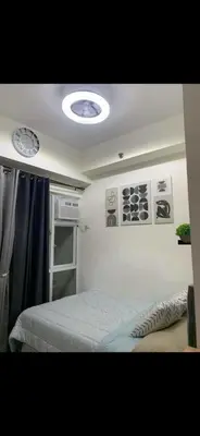 a bedroom with a bed in a room at Essel s Comfy Place in Manila