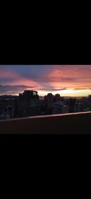 a view of a city skyline at sunset at Essel s Comfy Place in Manila