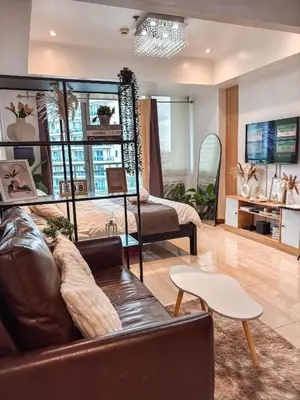 a living room with a couch and a table at Casa Del Sol in Manila
