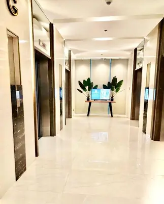 a hallway in a building with plants on the wall at Sleek Urban Staycation-2BR with Manila Bay View near MOA, PICC, World Trade Center and US Embassy in Manila