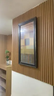 a painting on the wall of a room at Klassi Executive Stay near NAIA in Manila