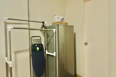 a skateboard is sitting on top of a refrigerator at Chic Getaway Near Airport in Manila