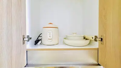 a kitchen appliance sitting on a shelf in a room at 1 Bedroom Unit near MOA & NAIA Terminal in Manila