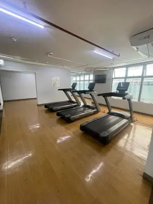 a row of treadmills in a gym at Antel Spa Residences 2602 in Manila