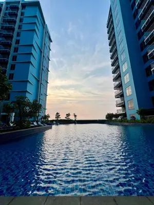 two tall buildings next to a large pool of water at 3BR Penthouse Suite Sunset View in front of Okada in Manila