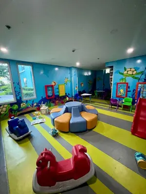 a childrens room with a play area with toys and a play room with at 3BR Penthouse Suite Sunset View in front of Okada in Manila