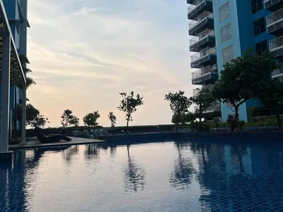 a swimming pool in the middle of a building at 3BR Penthouse Suite Sunset View in front of Okada in Manila