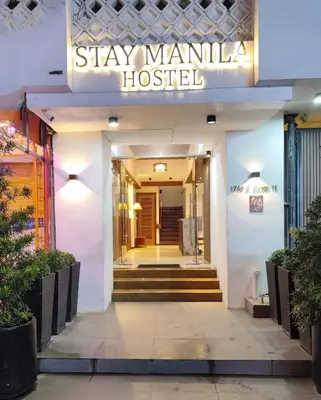 a building with a sign that reads stay manila hospital at Stay Manila Hostel in Manila