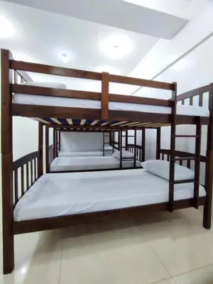 two bunk beds sitting in a room at Stay Manila Hostel in Manila