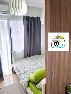 a small bedroom with a bed and a window at Little NOAH in Manila