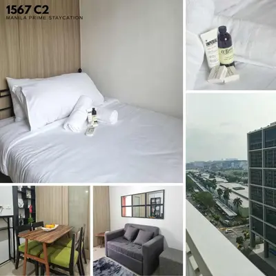 a hotel room with a bed and a view of a city at MP shore 1 c2 unit 1567 in Manila