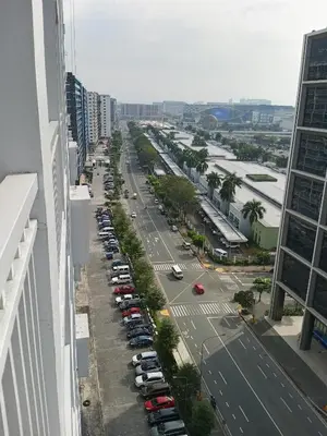 a city street with cars parked in a parking lot at MP shore 1 c2 unit 1567 in Manila