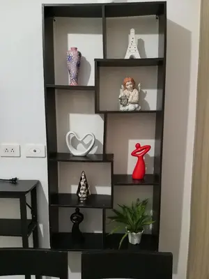 a shelf with vases and other items on it at MP shore 1 c2 unit 1567 in Manila