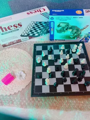 a chess board and a box and a box at Shell Residences in Manila