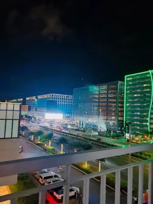 a view of a city at night with buildings at Shell Residences in Manila