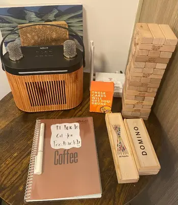 a table with a toaster and some books and boxes at Dayontabalay in Manila