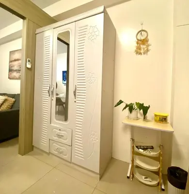 a dressing room with a mirror and a table at Dayontabalay in Manila
