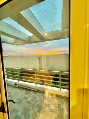 a view from a window of a balcony at Stylish New Condo at Covent Garden Sta Mesa in Manila