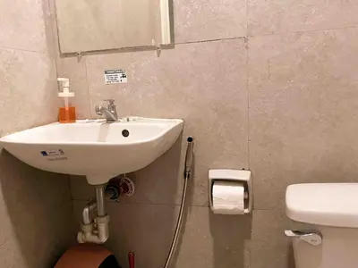 a bathroom with a sink and a toilet at Boho Scandinavian with free Netflix, Wifi & Parking in Dasmariñas
