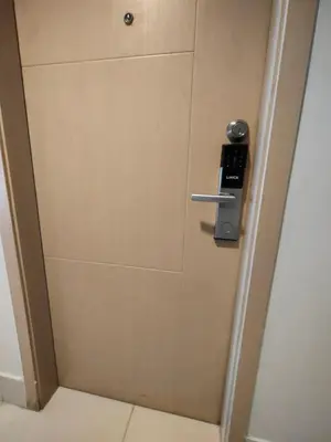 a door with a phone sticking out of it at Sea Residences By Jervis in Manila
