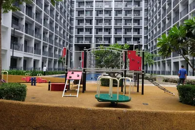 a playground in front of a tall building at Urban Luxe Suite - Shore 2 Residences, Steps to Mall of Asia Complex, Pasay City in Manila