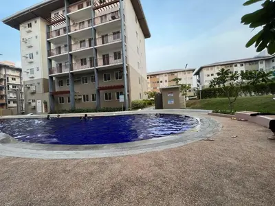 a large swimming pool in front of a building at Nuvali Amaia steps parkway in Calamba