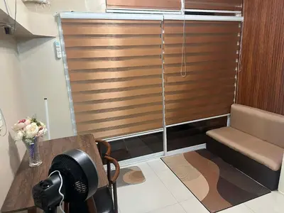 a room with a wooden door with a hair dryer at Cozy Loft Unit in Manila in Manila