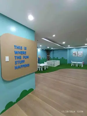 a room with a sign that reads this is where the run stuff happens at Sunshine100PioneermMandaluyong PoolGymBilliardsPlaygroundTVWifi in Manila