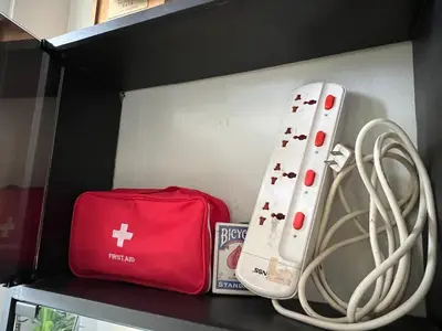a shelf with two wii controllers and a red bag at Mandaluyong HomeBest Place to Stay! in Manila
