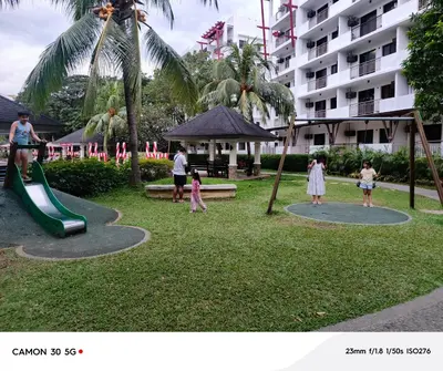 a group of people playing in a park at Resort Inspired Condo Beside NAIA Terminal 1 Near Okada and City of Dreams in Manila