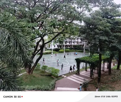a group of people playing basketball in a park at Resort Inspired Condo Beside NAIA Terminal 1 Near Okada and City of Dreams in Manila