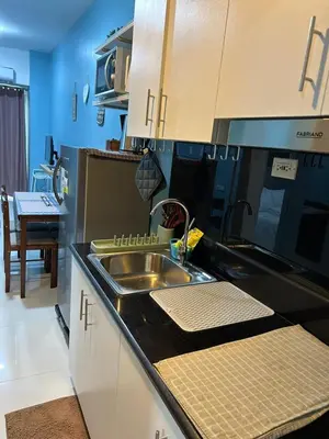 a kitchen with a sink and a counter top at MK's place in Manila
