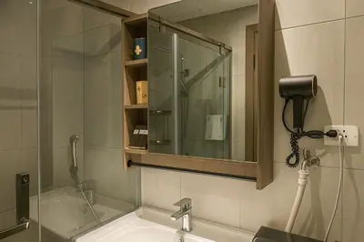 a bathroom with a sink and a mirror at Manila City Center Executive Apartments near Ayala Mall and PITX in Manila