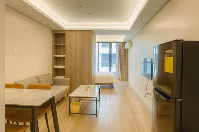 a living room with a couch and a table at Manila City Center Executive Apartments near Ayala Mall and PITX in Manila