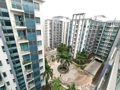 an aerial view of apartment buildings with palm trees at 1 bedroom Condotels Across terminal 3 airport in Manila
