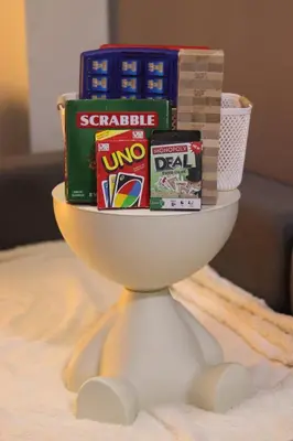 a toilet bowl filled with snacks and books at Cozy & Affordable Staycation Melrose Haven in Manila